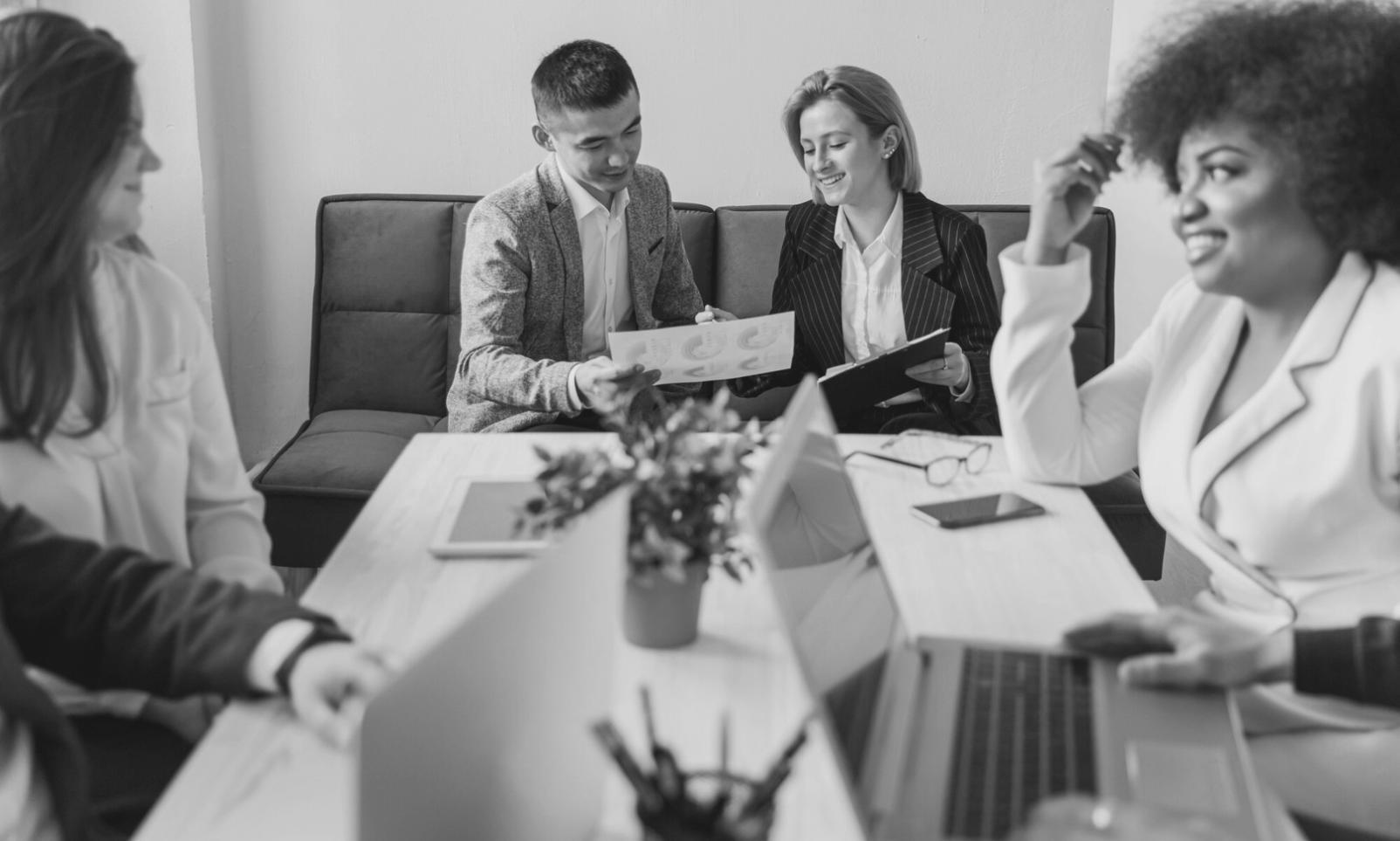 Professional financial advisory meeting showing detailed investment portfolio review and planning session